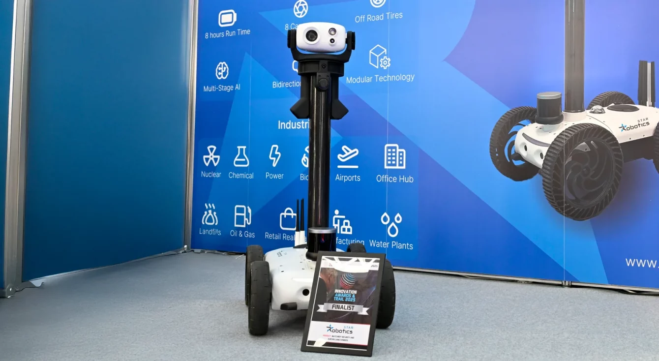 Watchbot robot on display at the Star Robotics booth, with the sectors panel in the background
